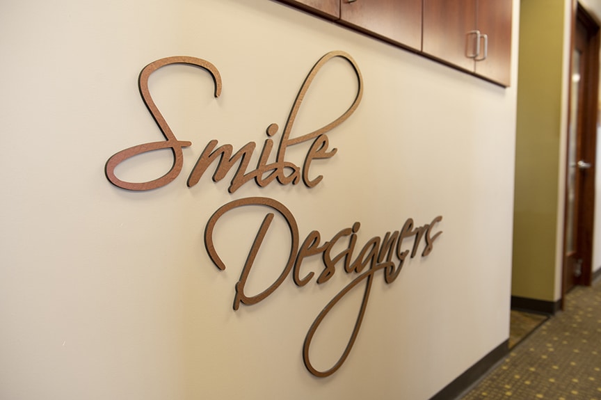 Smile Designers Logo on Wall