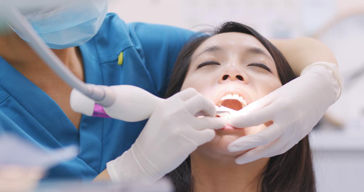Women gets procedure done at dentist