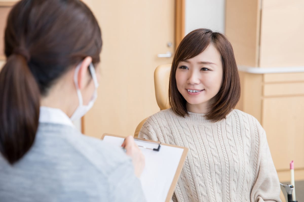 woman answering questions at appointment