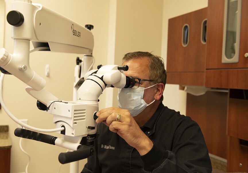 Dentist Using Microscope
