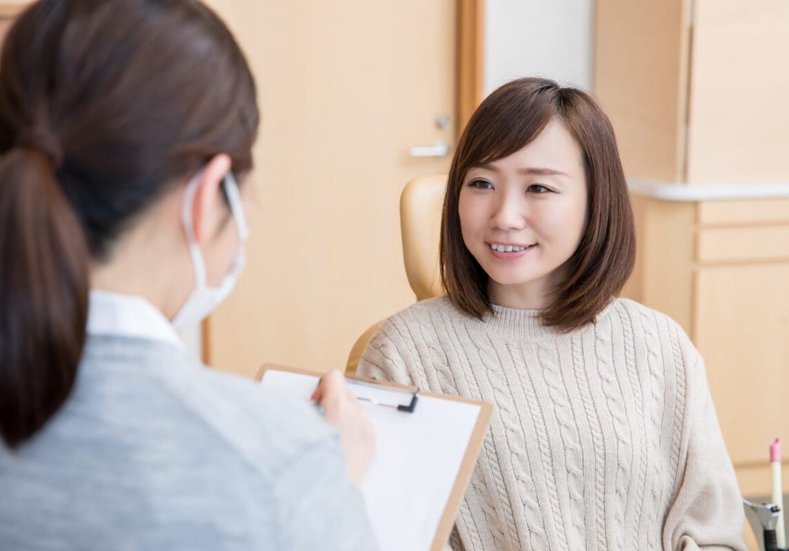 woman answering questions at appointment